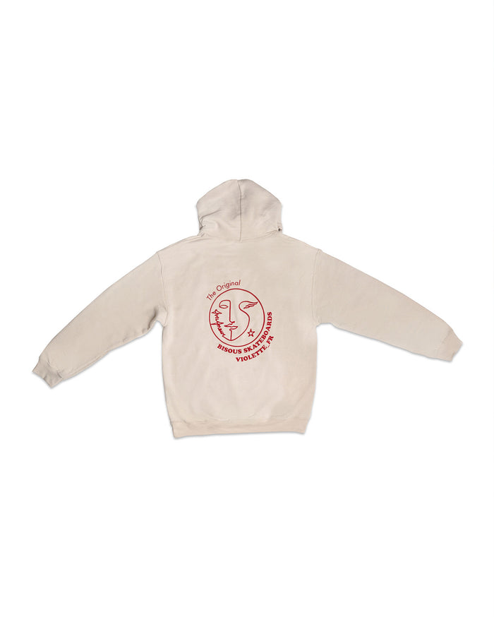 Back of a light beige hooded sweatshirt with a red circular logo featuring a stylized face illustration and the text 'The Original BISOU SKATEBOARDS VIOLETTE_FR'.