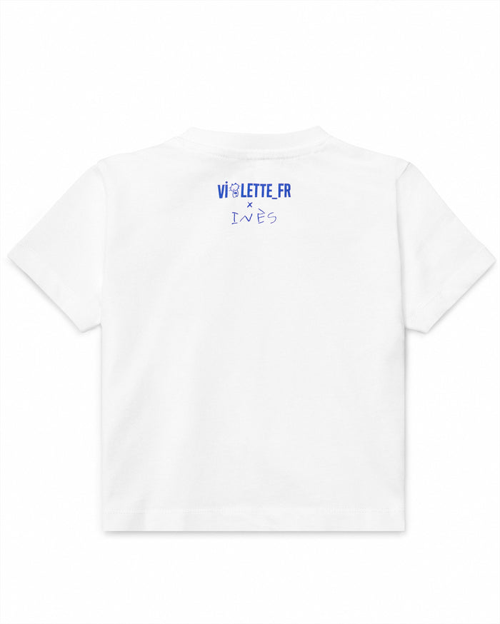 White t-shirt with blue text on the back that reads "VI♡LETTE_FR x INÈS".