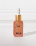 Dullness Rescue (radiance + revival serum) from VIOLETTE_FR in a frosted peach-pink dropper bottle with a gold collar.