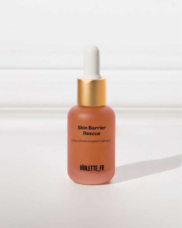 Skin Barrier Rescue (microflora support serum) by VIOLETTE_FR in a frosted peachy-pink dropper bottle with a gold cap.
