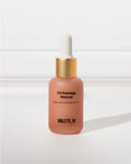 UV Damage Rescue (after sun calming serum) VIOLETTE_FR on a frosted peach dropper bottle with a gold collar and white top.