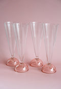 Set of four 90's flute glasses