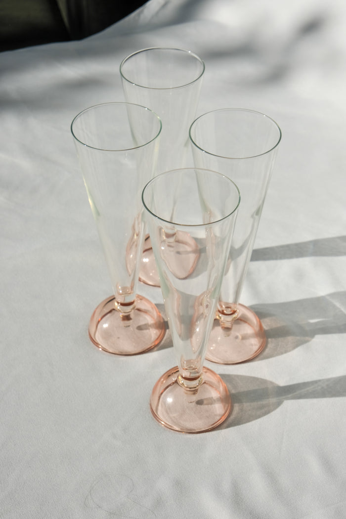 Set of four 90's flute glasses
