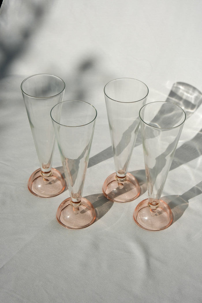 Set of four 90's flute glasses