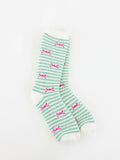 World's Softest women's green and white striped socks with pink bows on a white background