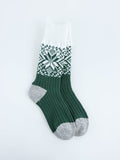 World's Softest women's green and white patterned sock on a light gray background