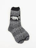 World's Softest black and white patterned crew sock with a white polar bear motif on the side, displayed against a plain white background.
