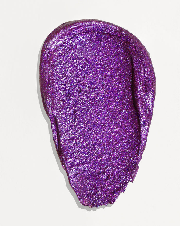 A swatch of glittery purple cosmetic product.